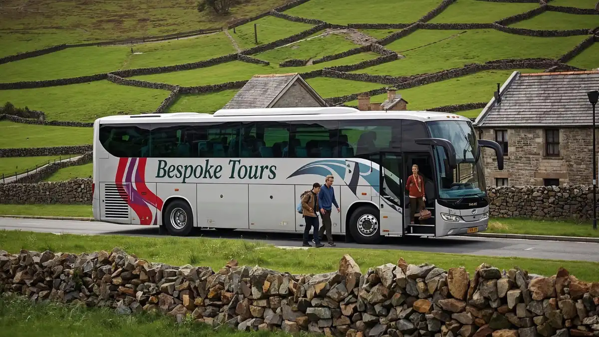 A modern luxury tour bus parked along a scenic road in the Irish countryside with stone walls and green hills, illustrating private group travel and bespoke guided tours.