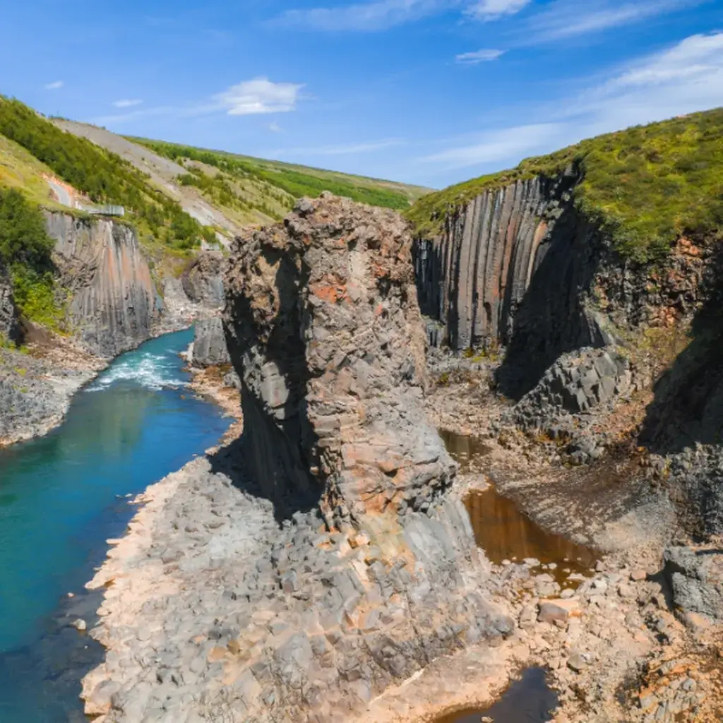 The dramatic basalt columns and glacial river of Stuðlagil Canyon in Iceland